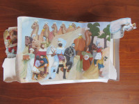 An assembled nativity scene folded into an accordion
